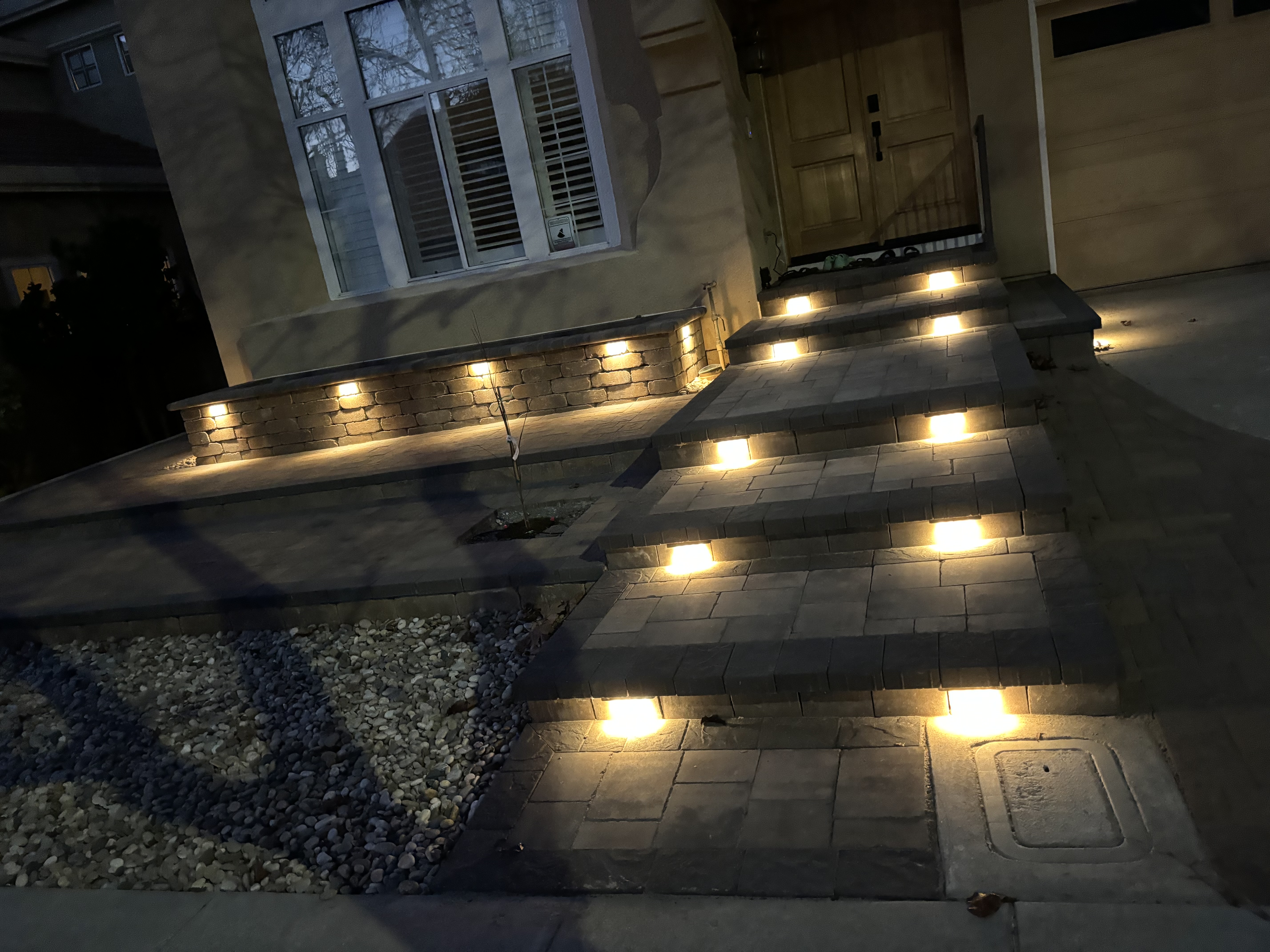 Residential front entry paver steps and walkway with integrated lighting